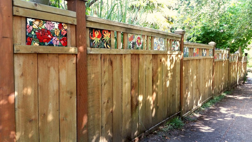 Yard fence with floral panels